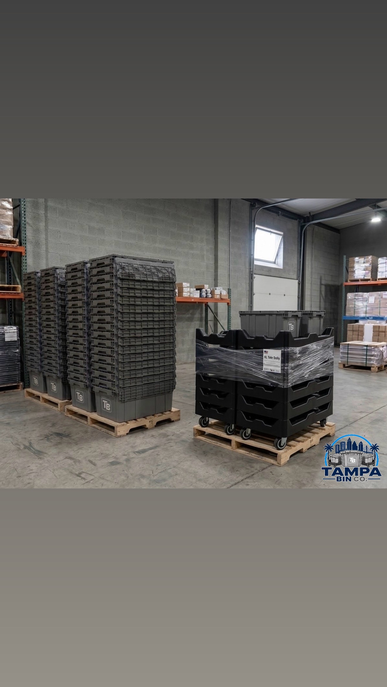 Tampa Bin Co bins and dollies stacked on pallets in warehouse